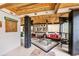 Spacious sunroom featuring wood ceilings, comfortable seating, and a 'Marsh Life' themed decor, great for entertaining at 830 Channel Cat Cove, Murrells Inlet, SC 29576