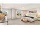 Spacious bedroom featuring a plush bed, textured ottomans, and a sliding glass door leading to outdoor space at 833 Ireland Dr., Longs, SC 29568