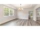 Bright dining room with luxury vinyl plank flooring and a modern chandelier at 843 Ireland Dr., Longs, SC 29568