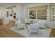 Stylish living room adjacent to the kitchen, with modern furniture, artwork and a wine rack for entertaining at 8518 Jazz Ct. # 77, Myrtle Beach, SC 29572