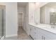 Bathroom featuring double vanity with framed mirror, large glass enclosed shower and access to large walk-in closet at 8713 High Banks Way, Longs, SC 29568