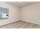 This bedroom features neutral walls, carpeted floors, and a window for natural light at 8713 High Banks Way, Longs, SC 29568