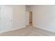 Neutral bedroom with carpeted floors shows doors to a closet and another room at 8713 High Banks Way, Longs, SC 29568