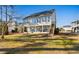 Spacious backyard featuring a large deck and staircase, perfect for outdoor entertaining and relaxation at 904 Easton Ct., Myrtle Beach, SC 29579