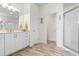 Bright bathroom with a granite countertop, white cabinetry, and a glass enclosed shower at 904 Easton Ct., Myrtle Beach, SC 29579