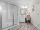 Bright bathroom featuring a vanity, sink, mirror, glass enclosed shower and tile flooring at 904 Easton Ct., Myrtle Beach, SC 29579