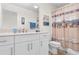 Bathroom with a white vanity, nautical themed decor and a shower with patterned curtain at 904 Easton Ct., Myrtle Beach, SC 29579