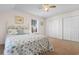 Bedroom with a queen bed with sea shell coverlet, carpeted flooring and a double door closet at 904 Easton Ct., Myrtle Beach, SC 29579