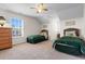 Bright bedroom featuring two twin beds, ceiling fan and natural light from the window at 904 Easton Ct., Myrtle Beach, SC 29579