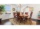 Warm dining room featuring a wood table, seating for six, and a decorative wreath by the window at 904 Easton Ct., Myrtle Beach, SC 29579