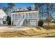 Charming two-story home features double garages and staircase to a covered balcony with lake views at 904 Easton Ct., Myrtle Beach, SC 29579