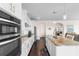 Modern kitchen with stainless steel appliances, sleek white cabinets, and a large center island at 904 Easton Ct., Myrtle Beach, SC 29579