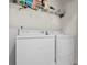 Functional laundry room with a white washer and dryer set at 904 Easton Ct., Myrtle Beach, SC 29579