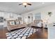 Inviting living room featuring hardwood floors, comfortable seating, and a view to the modern, white kitchen at 904 Easton Ct., Myrtle Beach, SC 29579