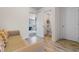 A bright living room featuring laminate wood flooring and a tan sofa at 904 Easton Ct., Myrtle Beach, SC 29579