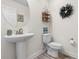 Powder room featuring a pedestal sink, nautical themed decor and laminate flooring at 904 Easton Ct., Myrtle Beach, SC 29579