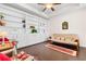 Cozy sitting room featuring a wall of built in bookcases and a casual futon sofa at 904 Easton Ct., Myrtle Beach, SC 29579