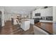 Bright kitchen featuring white cabinetry, stainless steel appliances, and a granite countertop island at 925 Oak Hollow St., Longs, SC 29568