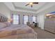 Spacious main bedroom featuring a tray ceiling, sitting area, and large dresser at 925 Oak Hollow St., Longs, SC 29568