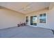 Covered patio with ceiling fan, sliding door, and concrete floor at 925 Oak Hollow St., Longs, SC 29568