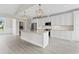 Well-lit kitchen featuring white cabinets, granite counters, and stainless appliances at Tbb Lot #3 Lakeside Dr., Conway, SC 29526