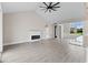 Light-filled living room with a modern fireplace and a large window at Tbb Lot #3 Lakeside Dr., Conway, SC 29526