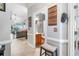 Hallway view featuring a cozy living area and adjacent bathroom, with stylish decor and tile flooring at 100 Birch N Coppice Dr. # 12, Surfside Beach, SC 29575