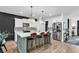 Beautiful kitchen with a large island, pendant lights, modern appliances, and bar stool seating at 1012 Baker Creek Loop, Myrtle Beach, SC 29579