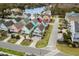 Aerial view of the home in a neighborhood featuring palm trees and a view of the water at 1032 N Ocean Blvd., Surfside Beach, SC 29575