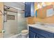 This bathroom features a beautiful vanity, mirror, and tiled walk-in shower at 1032 N Ocean Blvd., Surfside Beach, SC 29575