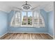 Bedroom with wood flooring and large bay window lets in ample natural light at 1032 N Ocean Blvd., Surfside Beach, SC 29575