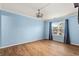 Bright bedroom with wood flooring, a modern fan and a large window with neighborhood views at 1032 N Ocean Blvd., Surfside Beach, SC 29575