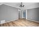 This bedroom features grey walls, wood flooring, and two closets at 1032 N Ocean Blvd., Surfside Beach, SC 29575