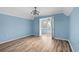 Bright bedroom with wood flooring, a modern fan and views of the neighborhood at 1032 N Ocean Blvd., Surfside Beach, SC 29575