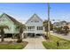 Charming coastal home featuring a light blue exterior, covered parking and a inviting front porch at 1032 N Ocean Blvd., Surfside Beach, SC 29575