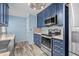 Well-equipped kitchen featuring stainless steel appliances, custom cabinets, and neutral countertops at 1032 N Ocean Blvd., Surfside Beach, SC 29575