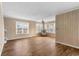Spacious living room featuring wood floors, paneled walls, and multiple windows at 1032 N Ocean Blvd., Surfside Beach, SC 29575
