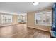 Bright and airy living room featuring wood floors, paneled walls, and oversized windows at 1032 N Ocean Blvd., Surfside Beach, SC 29575