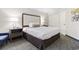 Bright bedroom with a large comfortable bed, side table, and closet at 1105 S Ocean Blvd. # 1134, Myrtle Beach, SC 29577