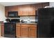 Kitchen with stainless steel appliances, granite countertops, and wood cabinets at 1105 S Ocean Blvd. # 1134, Myrtle Beach, SC 29577