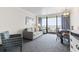 Comfortable living room featuring a sofa, chair, dining table, and balcony access with ocean views at 1105 S Ocean Blvd. # 1134, Myrtle Beach, SC 29577