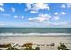 Wide beach with palm trees near the resort and views of the ocean and blue skies at 1105 S Ocean Blvd. # 732, Myrtle Beach, SC 29577