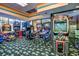 Lively game room with multiple arcade machines and carpet offers an entertainment space at 1105 S Ocean Blvd. # 732, Myrtle Beach, SC 29577