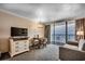 Inviting condo space with a TV, dining area, and balcony overlooking the ocean at 1105 S Ocean Blvd. # 732, Myrtle Beach, SC 29577