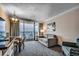 A cozy condo living area featuring a sofa, dining table, and balcony with a view of the ocean at 1105 S Ocean Blvd. # 732, Myrtle Beach, SC 29577