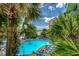 An outdoor pool area surrounded by palm trees and lounge chairs offers a relaxing vacation experience at this resort at 1105 S Ocean Blvd. # 732, Myrtle Beach, SC 29577