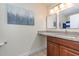 Bathroom features a granite countertop, vanity and decorative mirror at 1250 River Oaks Dr. # 16B, Myrtle Beach, SC 29579