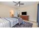 Bedroom with a ceiling fan, dresser, and gray rug, offers a comfortable and stylish retreat at 1250 River Oaks Dr. # 16B, Myrtle Beach, SC 29579