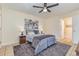 Bedroom features neutral walls, gray rug, and ceiling fan, creating a serene and inviting atmosphere at 1250 River Oaks Dr. # 16B, Myrtle Beach, SC 29579
