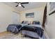 Bedroom features a ceiling fan, closet, and twin beds, offering a comfortable and stylish retreat at 1250 River Oaks Dr. # 16B, Myrtle Beach, SC 29579